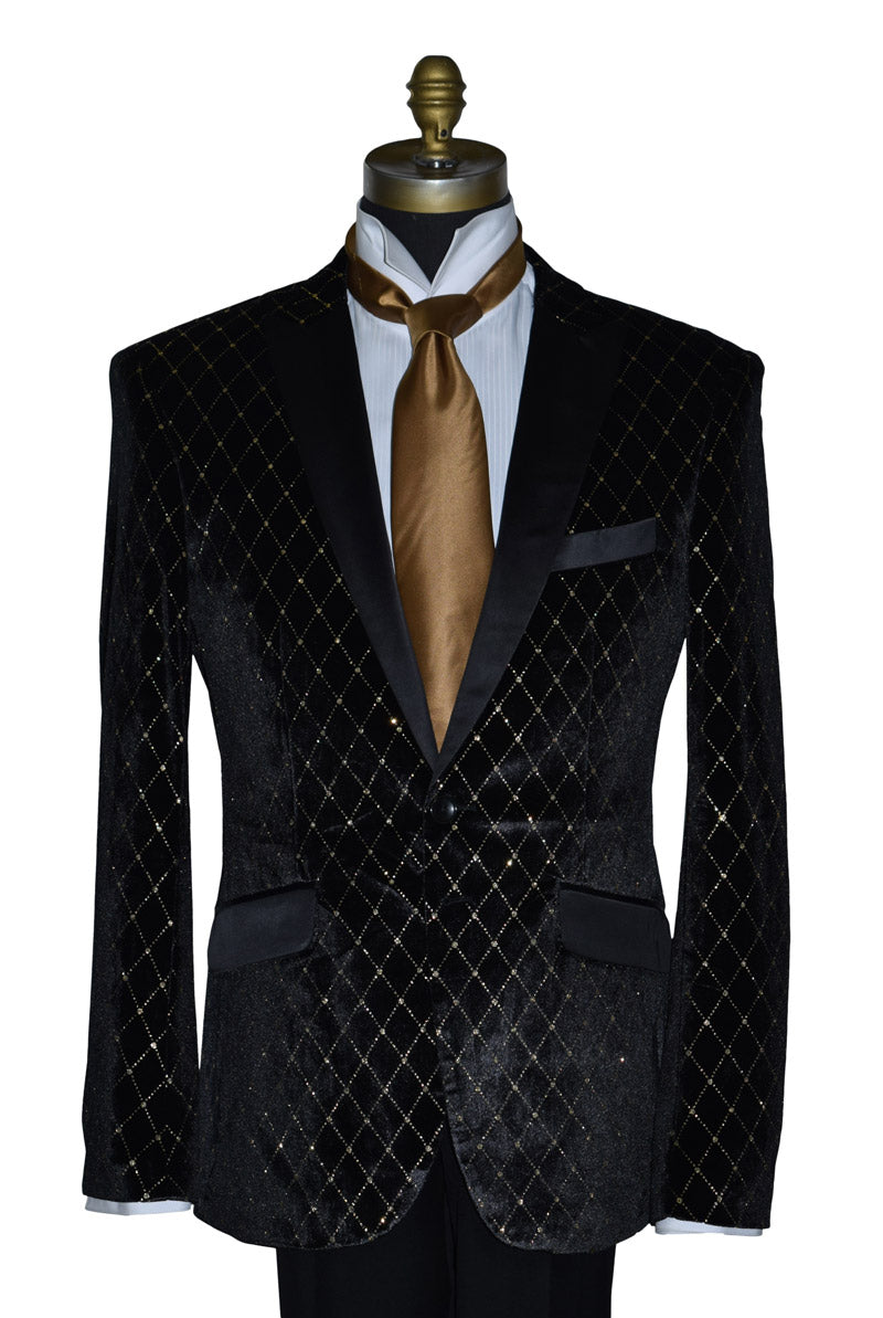 black velvet tuxedo with gold diamonds pattern on a mannequin with a long gold necktie and a white tuxedo shirt