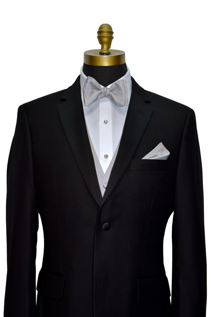 Black tuxedo with white shirt and moonlight-grsy "tie-yourself" bow tie on a mannequin against a white background