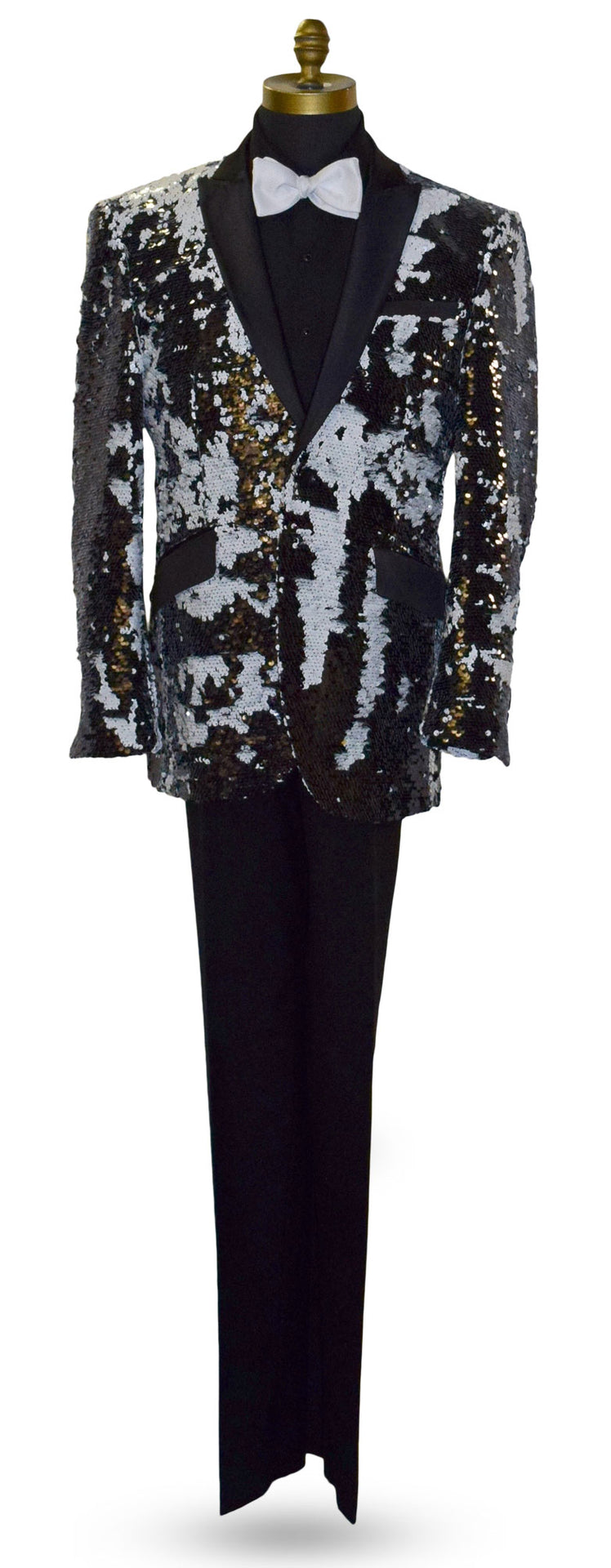 close-up Black and white sequin jacket on a mannequin with a black tuxedo shirt and white bowtie against a white background