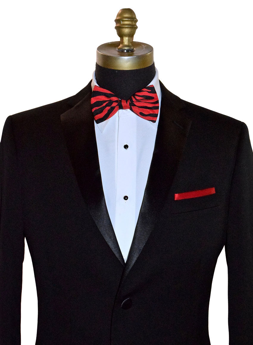 Black tuxedo with a crimson red and black zebra print bow tie on a mannequin against a white background.