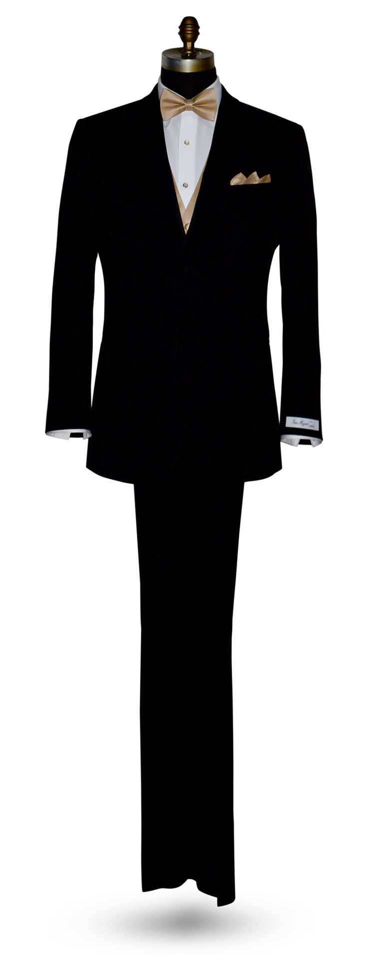 life-size mannequin wearing a "San Miguel Especial" branded black notch-lapel tuxedo with white shirt, golden "tie-yourself" bowtie and a golden vest, and pocket square against a white background