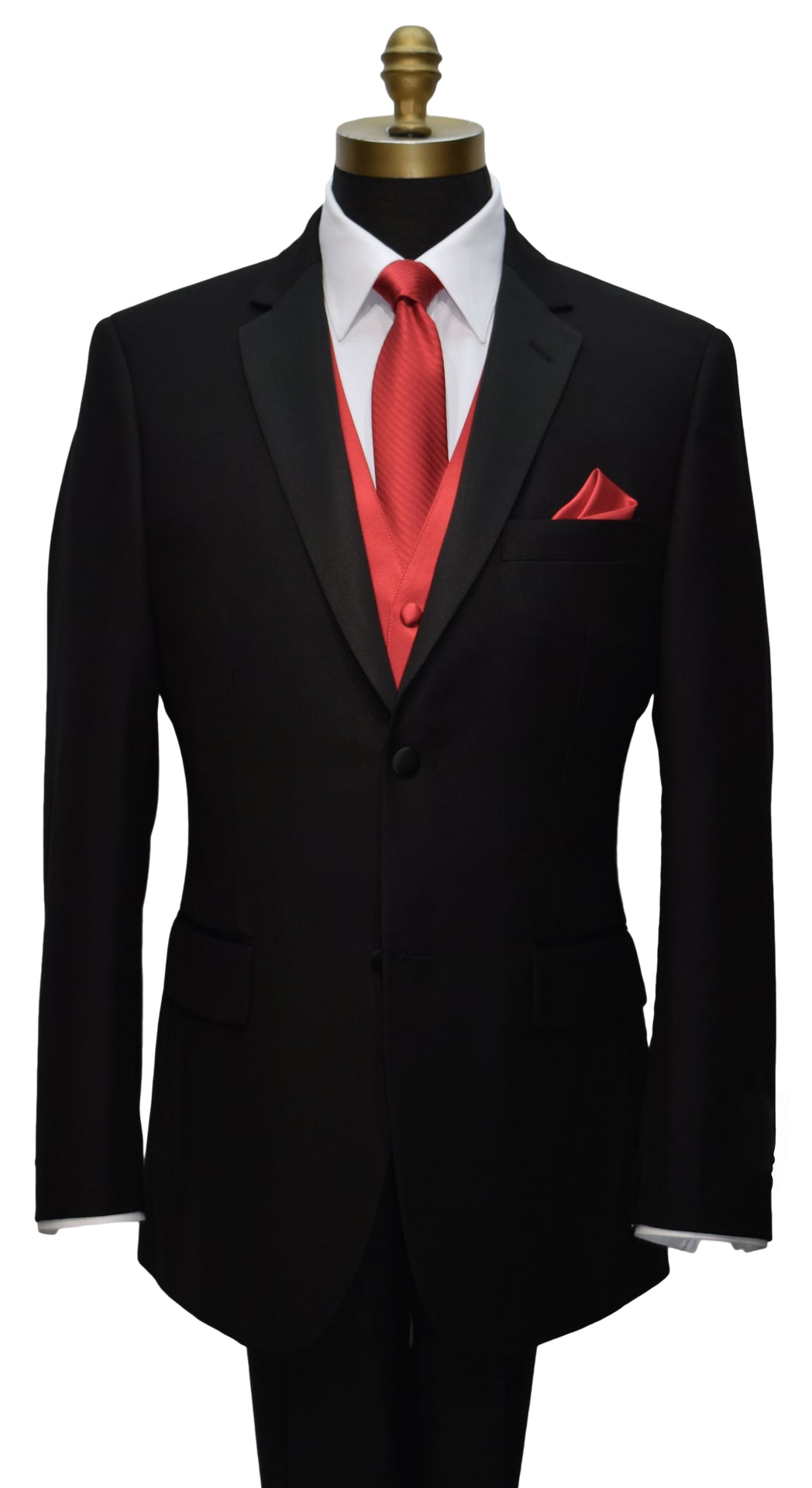 close-up mannequin wearing a black notch-lapel tuxedo with a white dress shirt with a ruby-red long necktie and ruby red vest and pocket handkerchief against a white background