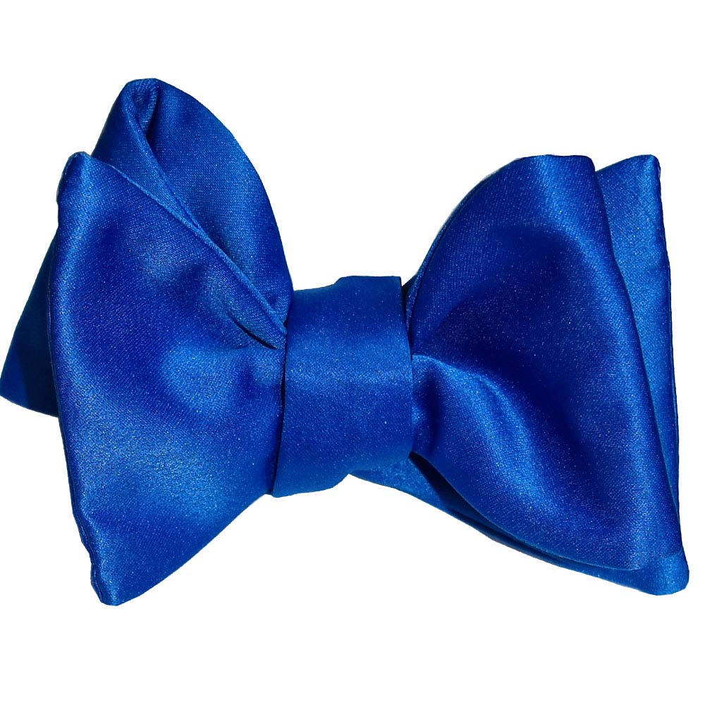 closeup royal blue "self-tie" bowtie against a white background