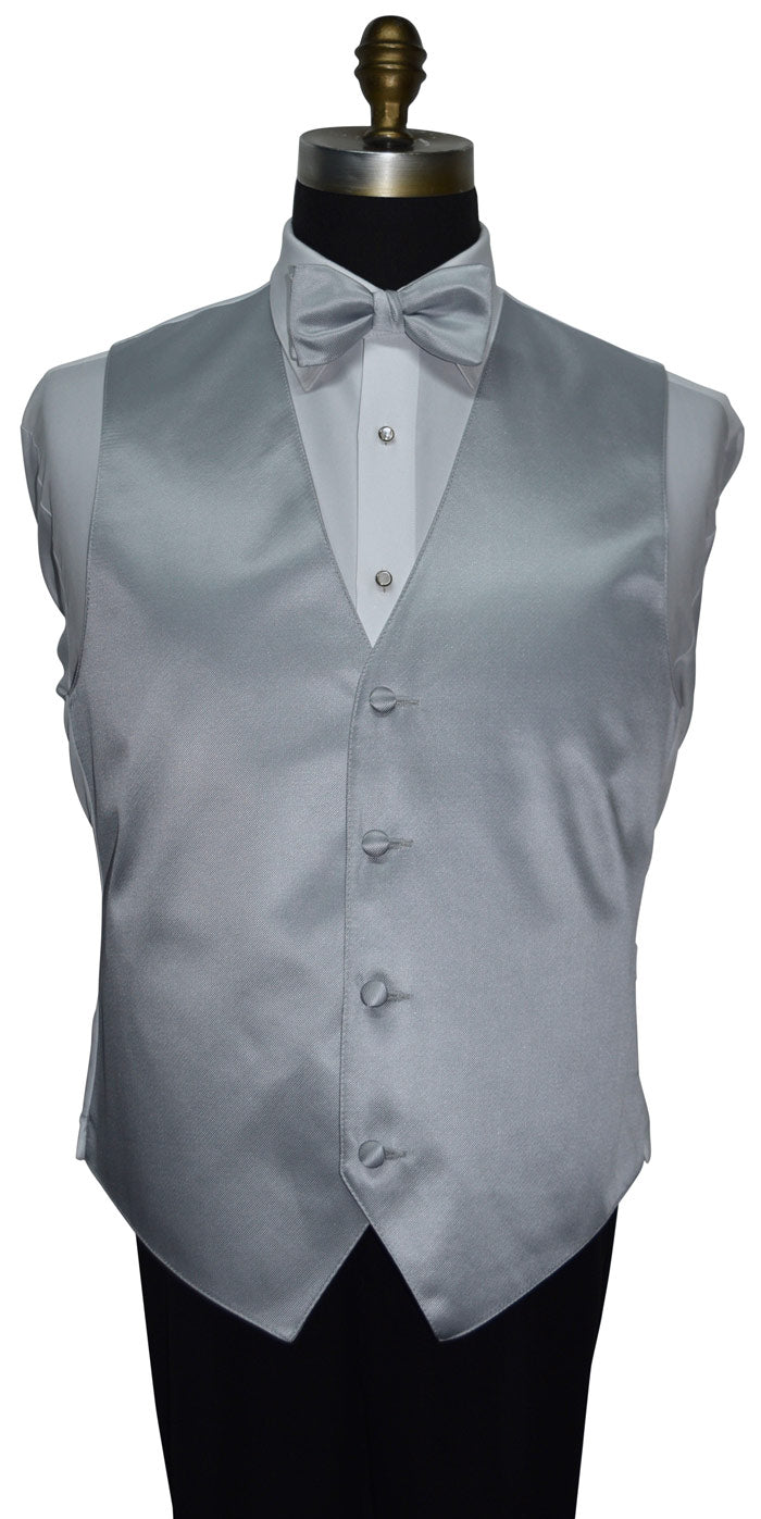 mannequin wearing a silver vest and silver pre-tied bowtie and black tuxedo pants against a whote background