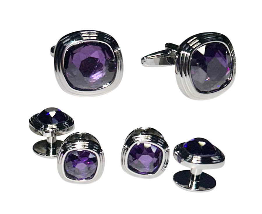 Set of purple gemstone cufflinks with silver borders on a white background