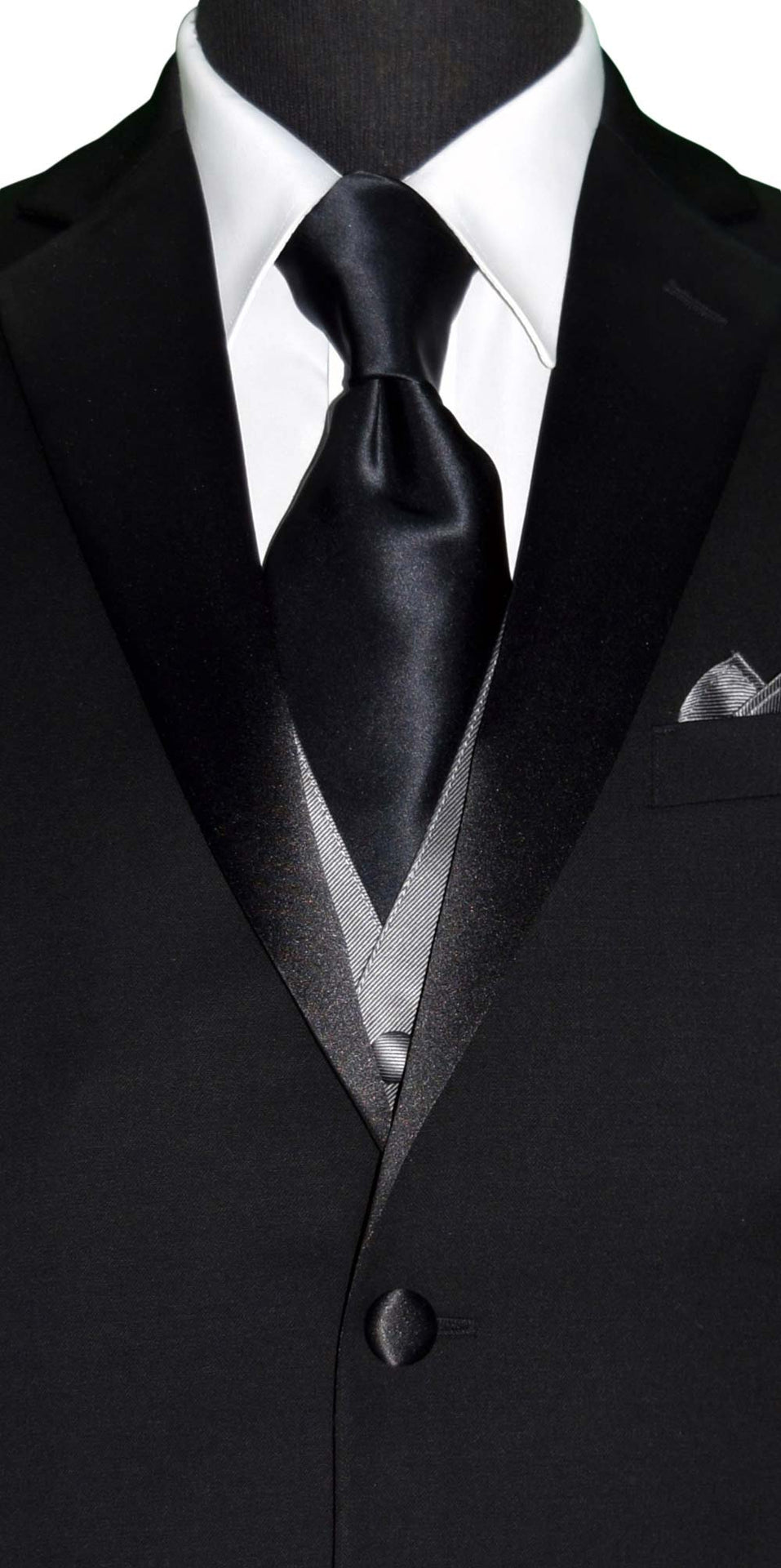 CLOSE-UP FRONT VIEW Black suit with gray vest, white shirt, and black silk neck-tie on a white background