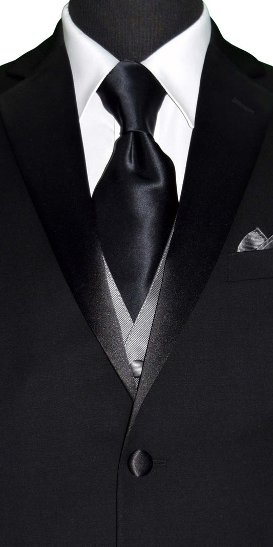 CLOSE-UP FRONT VIEW Black suit with gray vest, white shirt, and black silk neck-tie on a white background