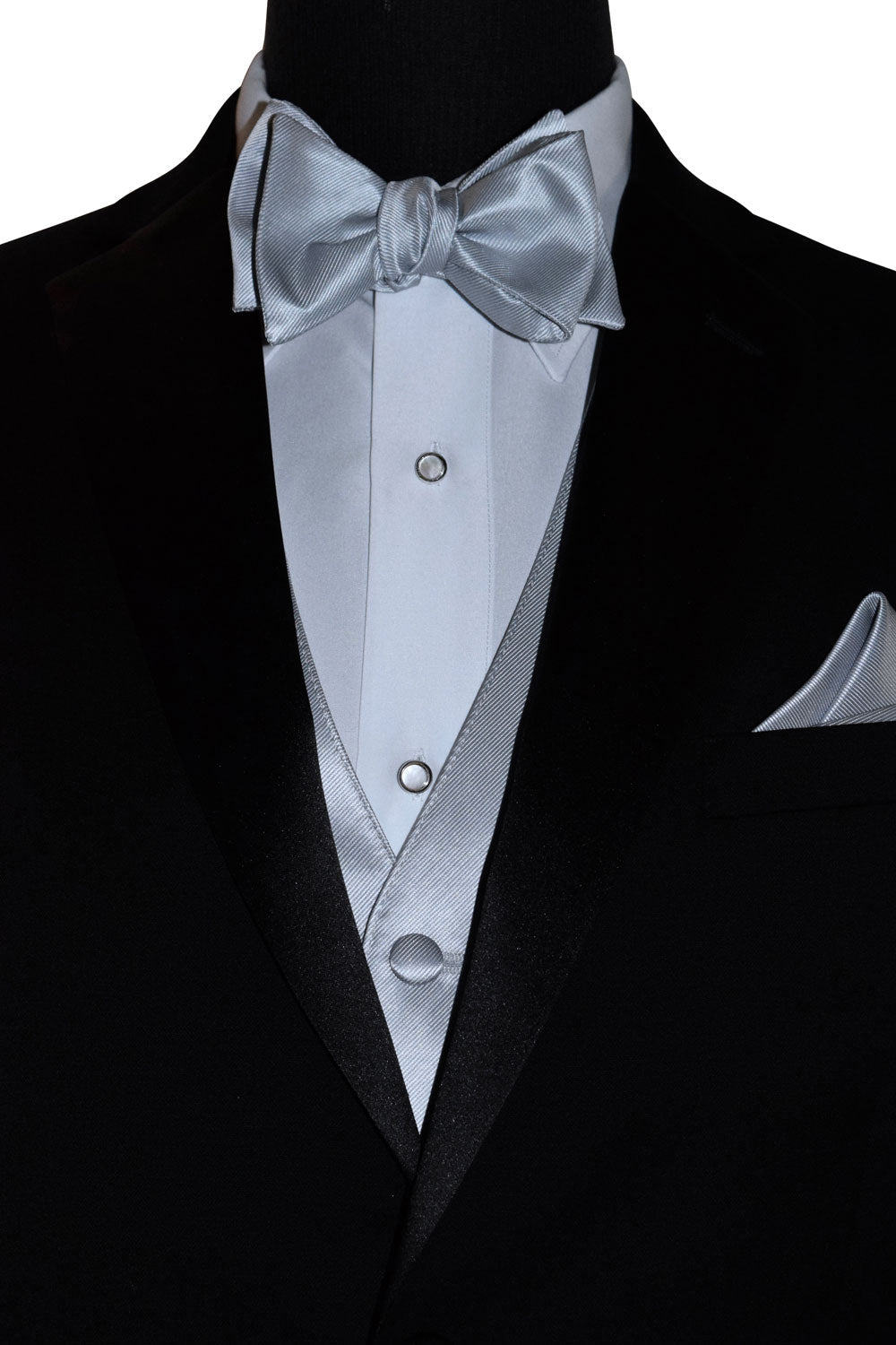 close-up Black tuxedo with silver "tie-yourself" bow tie and pocket square on a mannequin against a whute background