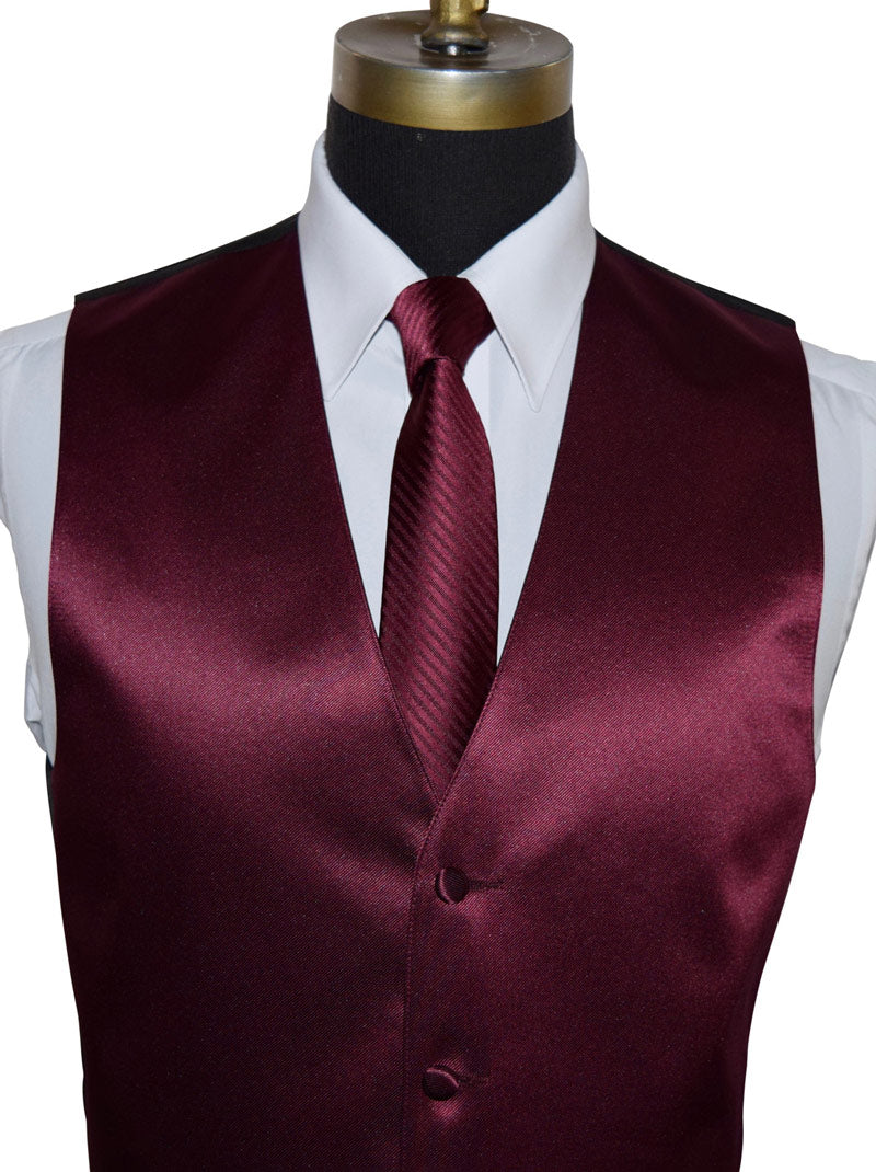 close-up white tuxedo shirt with a wine tuxedo vest and wine color necktie with subtle stripe