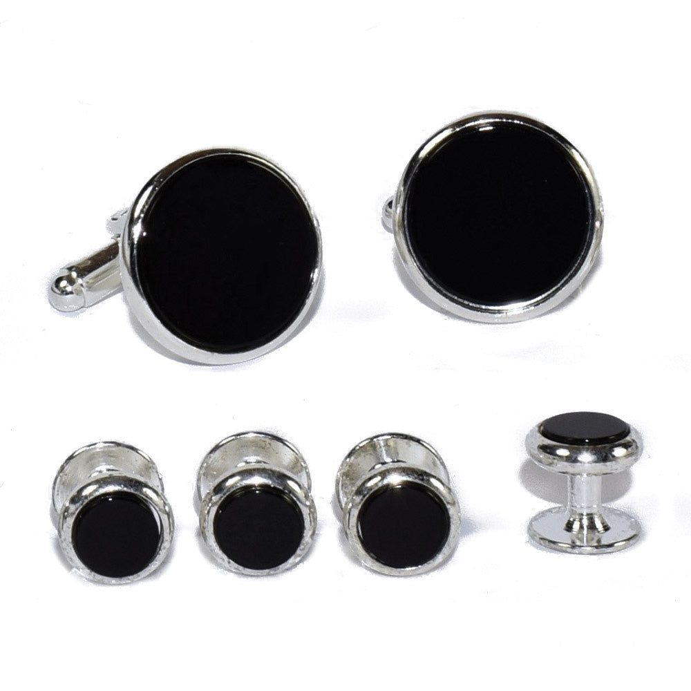 Set of black round onyx cufflinks and studs in a silver setting on a white background