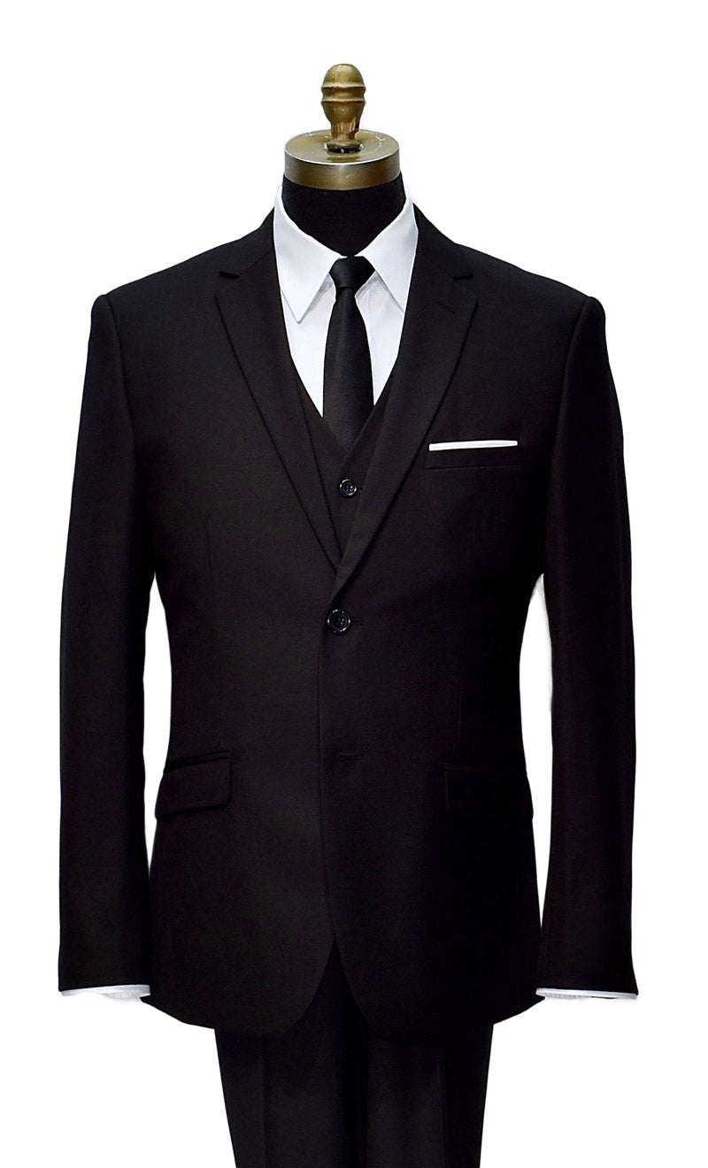 Black suit on a mannequin with a white shirt and black satin skinny dres-tie against a white background