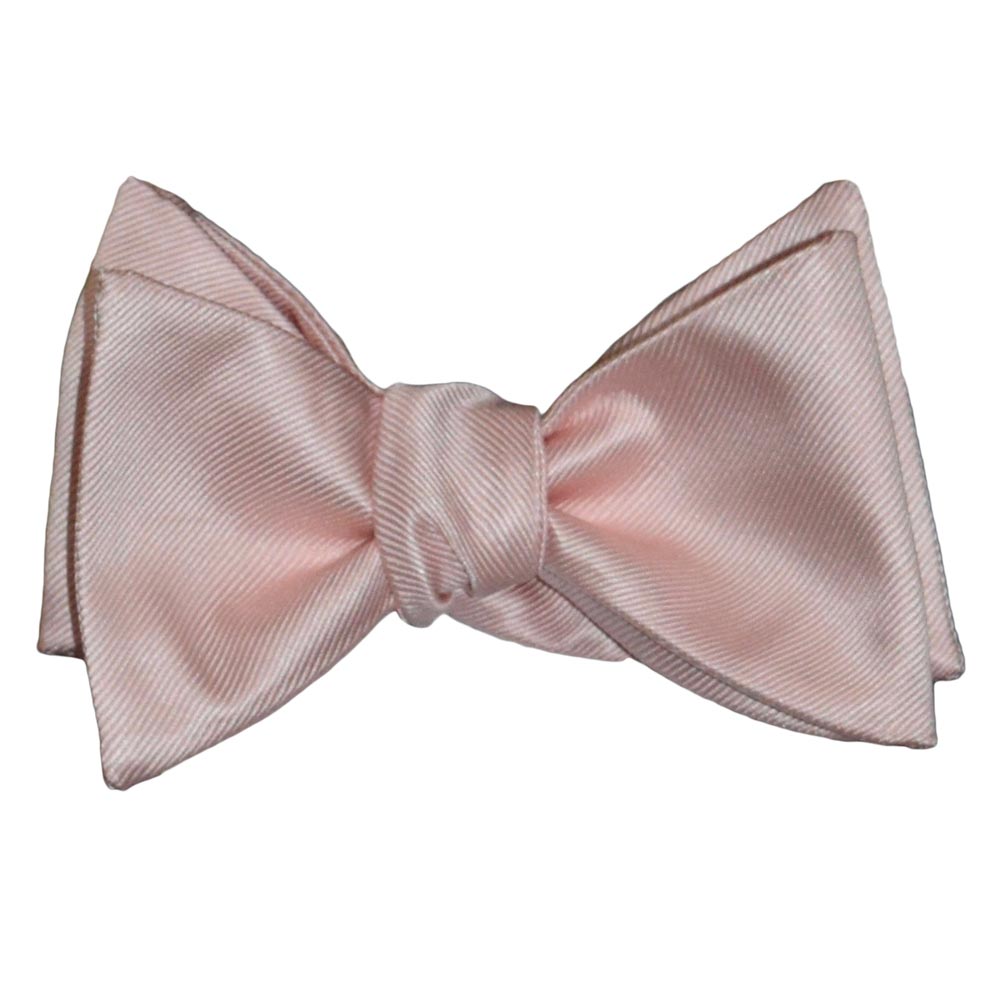 blush colored "tie-yourself" bow tie on a white background