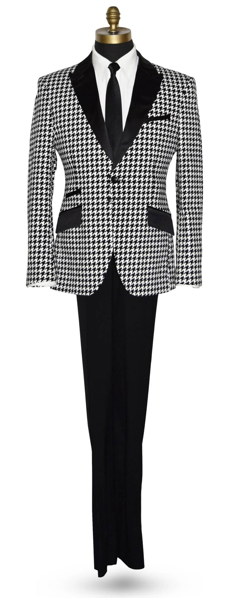 Houndstooth patterned tuxedo jacket with black lapels and pants on a mannequin wearing a white shirt with a black skinny dress-tie against a white background