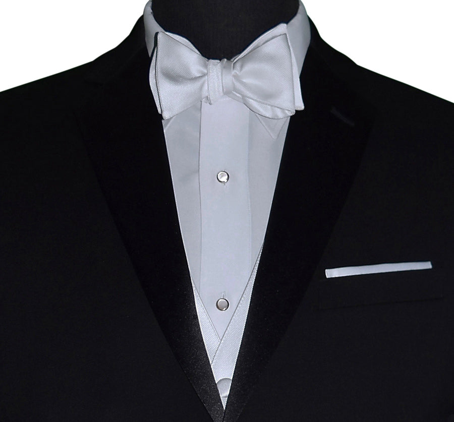 close-up of mannequin wearing a black tuxedo with white bowtie and mother-of-pearl studs and cufflinks by San Miguel Formals