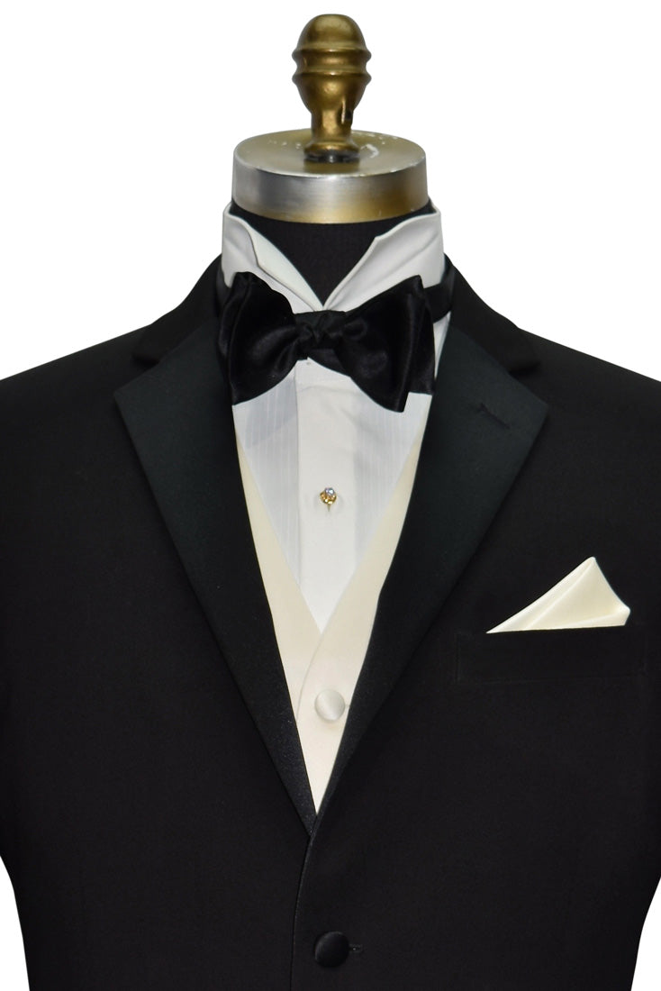 DETAILED CLOSE UP of a Black slim-fit notch lapel tuxedo with ivory satin vest and black satin "tie-yourself" bowtie.