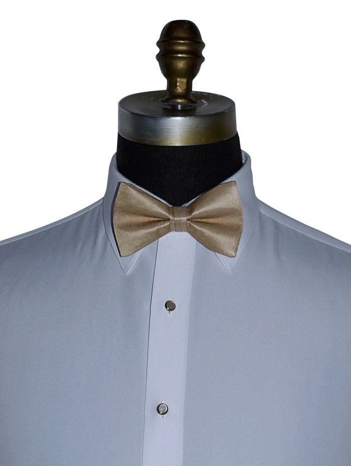 white dress shirt with a golden "pre-tied"  bow tie on a mannequin against a white background