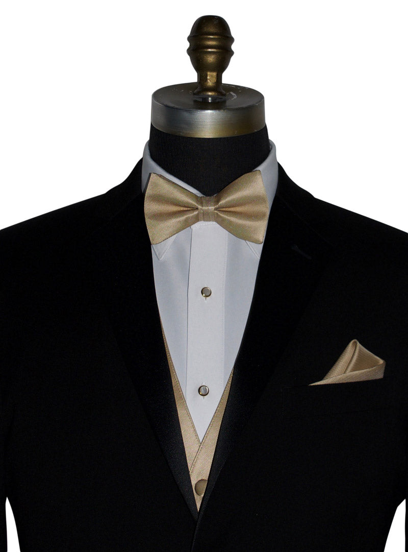 close-up black tuxedo wearing a tuxedo shirt with a golden "pre-tied" bowtie and vest against a white background
