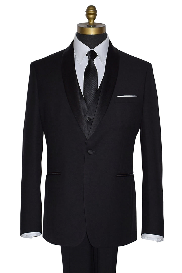Black three-piece suit with a with a white shirt and black necktie with subtle stripe on a mannequin against a white background