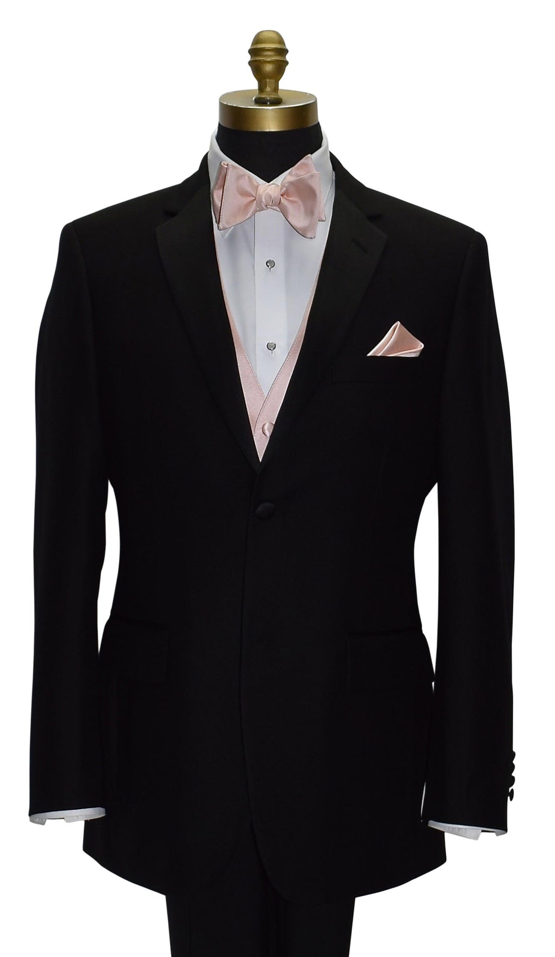 Black tuxedo with a white shirt, blush bow tie, and pocket square on a mannequin.