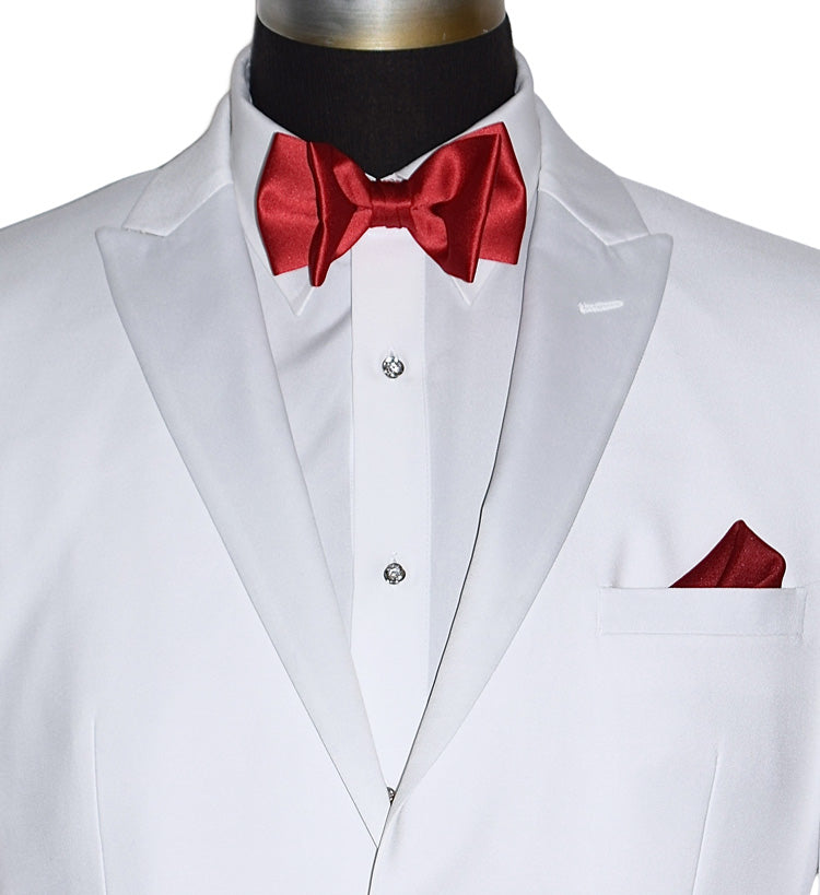 mannequin wearing a white tuxedo with a red bow tie and pocket square with cubic zirconia cufflinks and studs against a white background