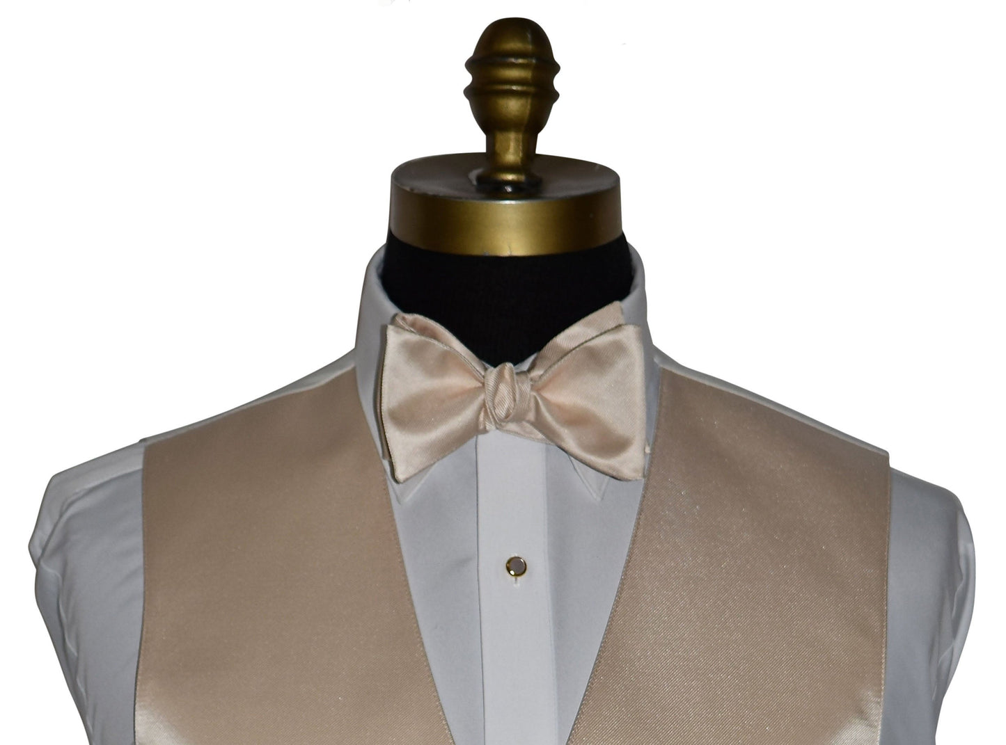 very close up champagne "tie-yourself" bowtie and champagne vest on a mannequin against a white background