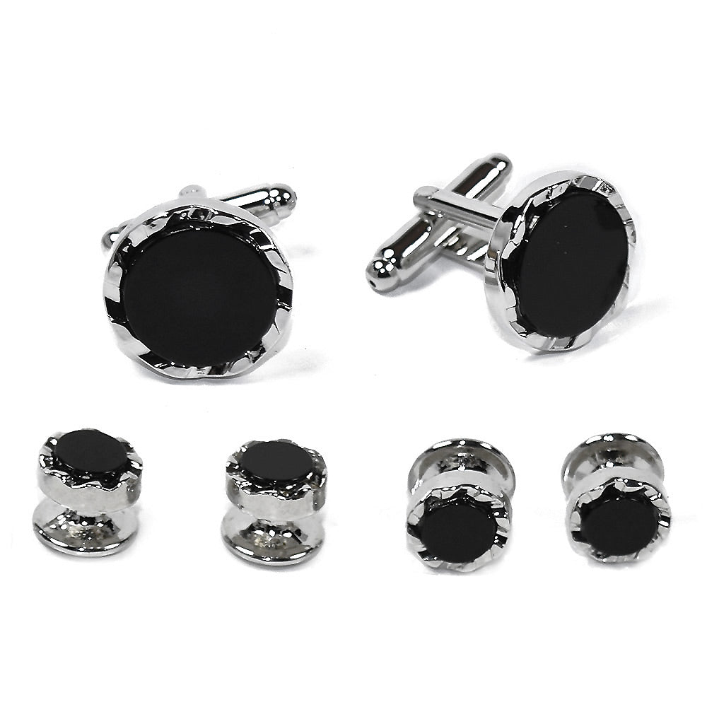 Cufflinks and stud set with black onyx gemstones and silver castle cut setting on a white background