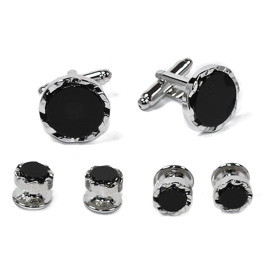 Cufflinks and stud set with black onyx gemstones and silver castle cut setting on a white background