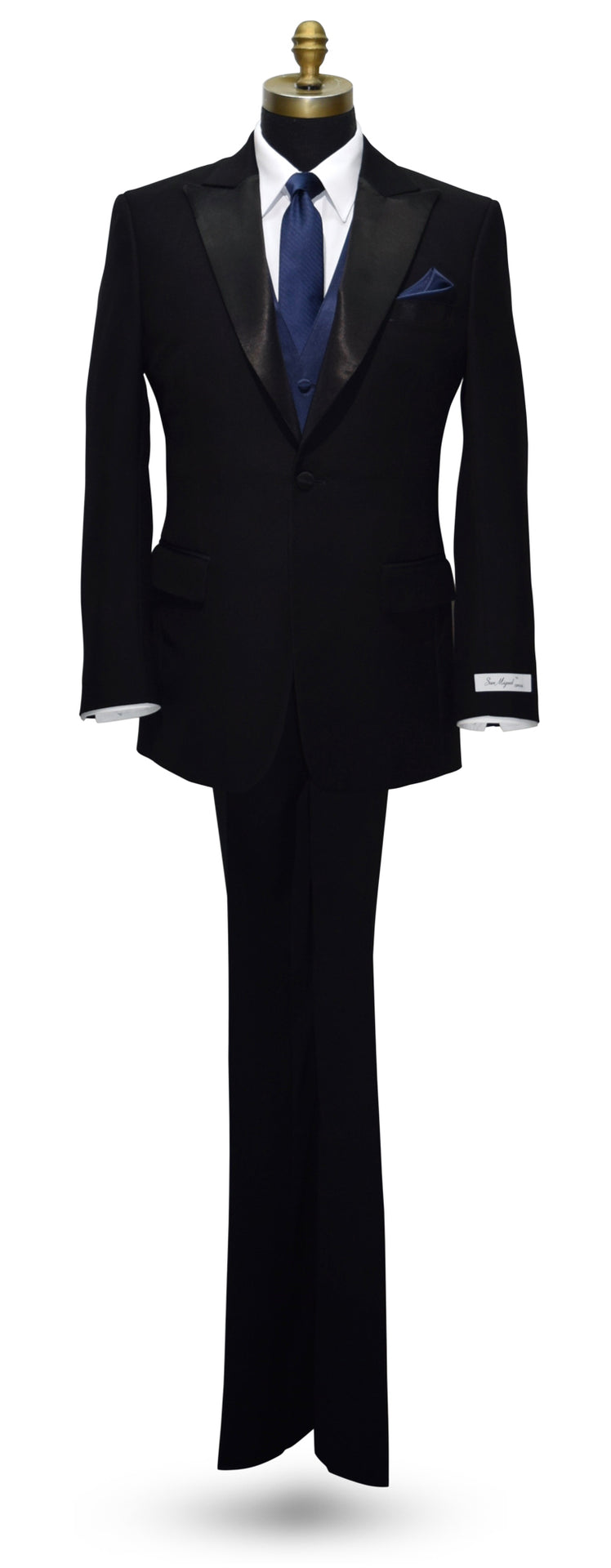 Black peak lapel tuxedo with a blue necktie and blue vest on a white background