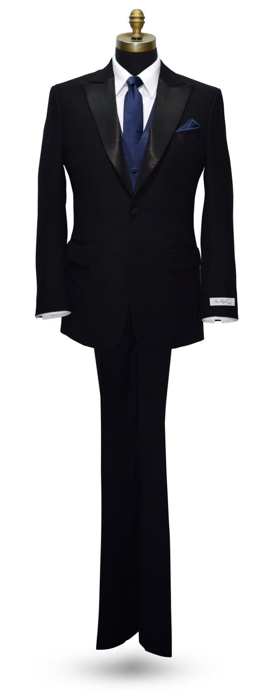 Black peak lapel tuxedo with a blue necktie and blue vest on a white background