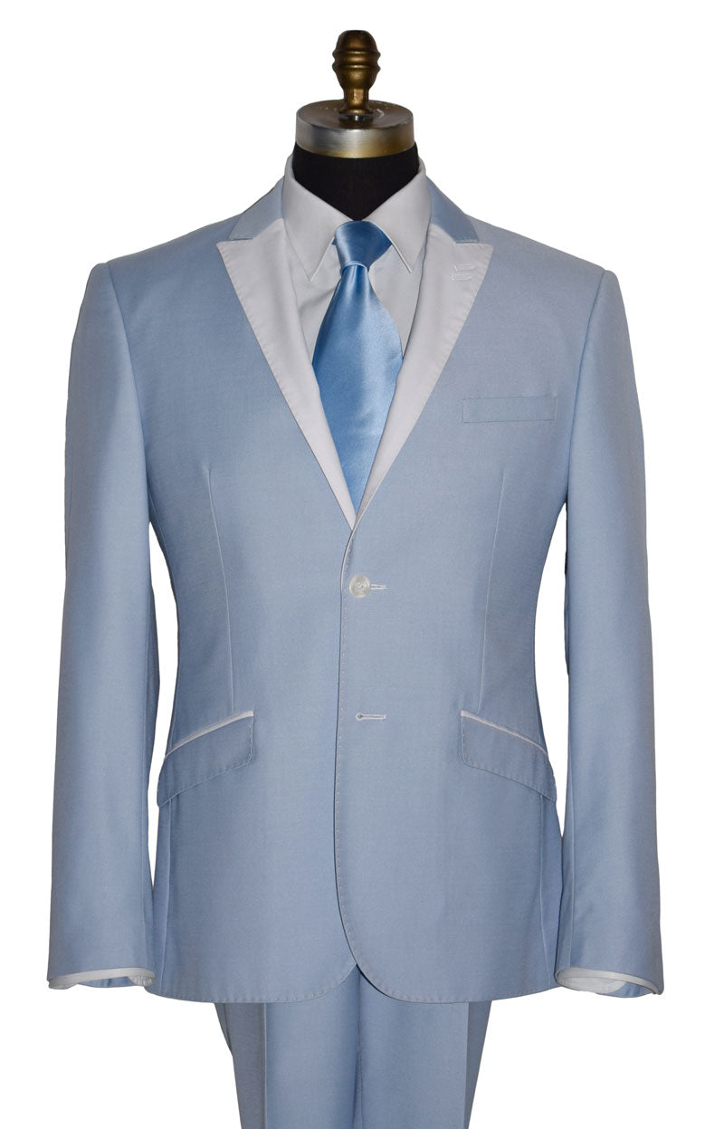 close-up mannequin wearing a powder blue tuxedo with a baby blue silk necktie and mother-of-pearl studs and cufflinks against a white background