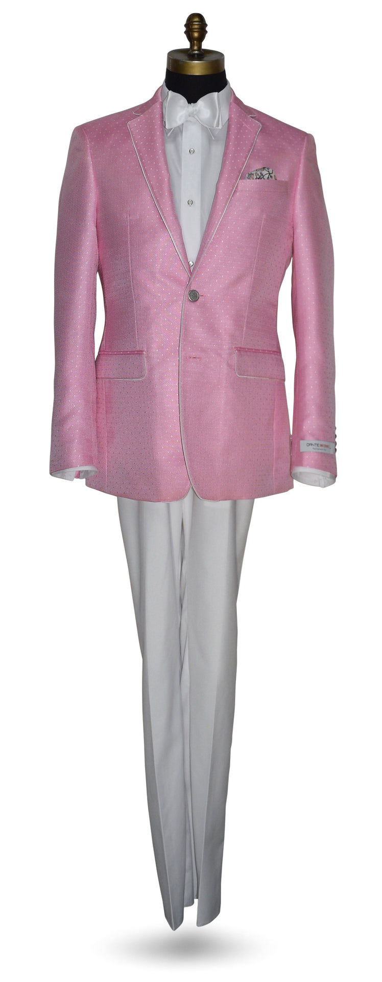 mannequin wearing a pink dinner jacket with white pants a white shirt and white bowtie