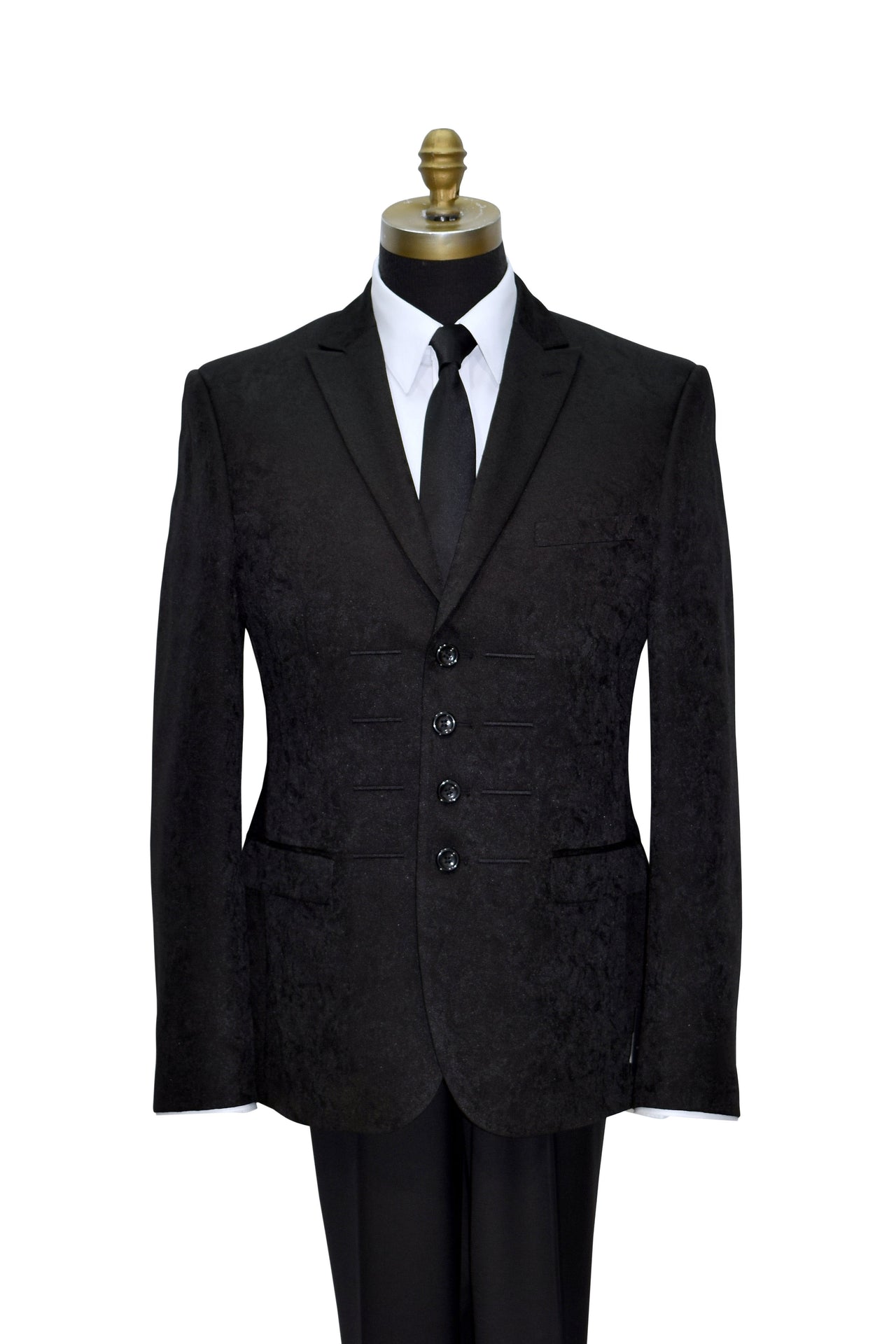 black brocade peak-lapel tuxedo on a mannequin against white background