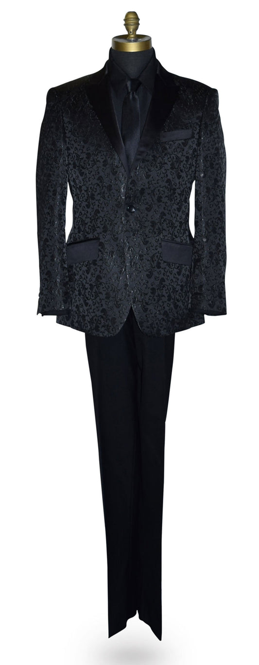 Black brocade tuxedo wearing a black shirt and long black necktie on a mannequin against a white background