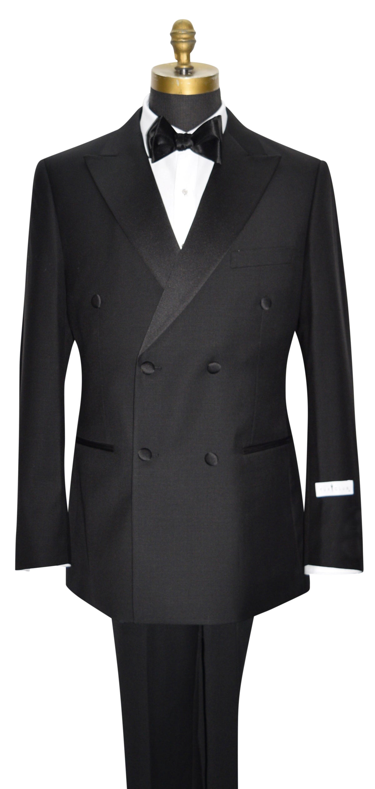 mannequin wearing a black double breasted tuxedo with a black bowtie against a white background