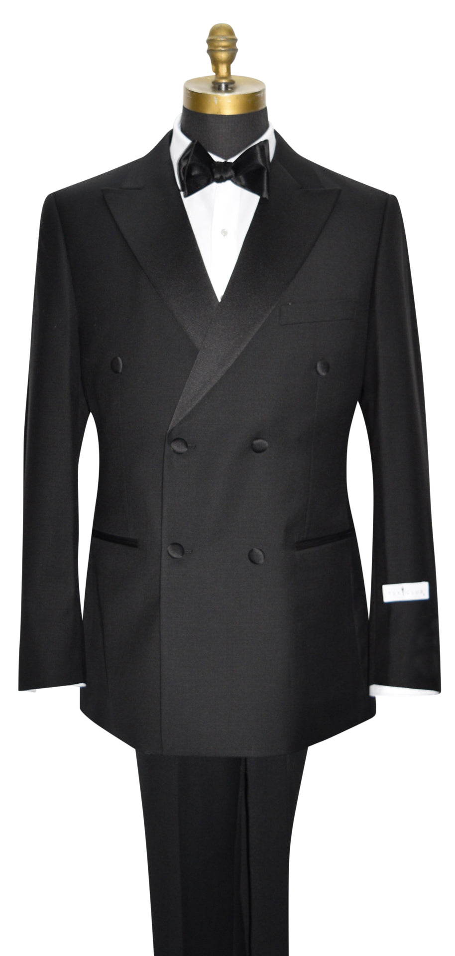 mannequin wearing a black double breasted tuxedo with a black bowtie against a white background
