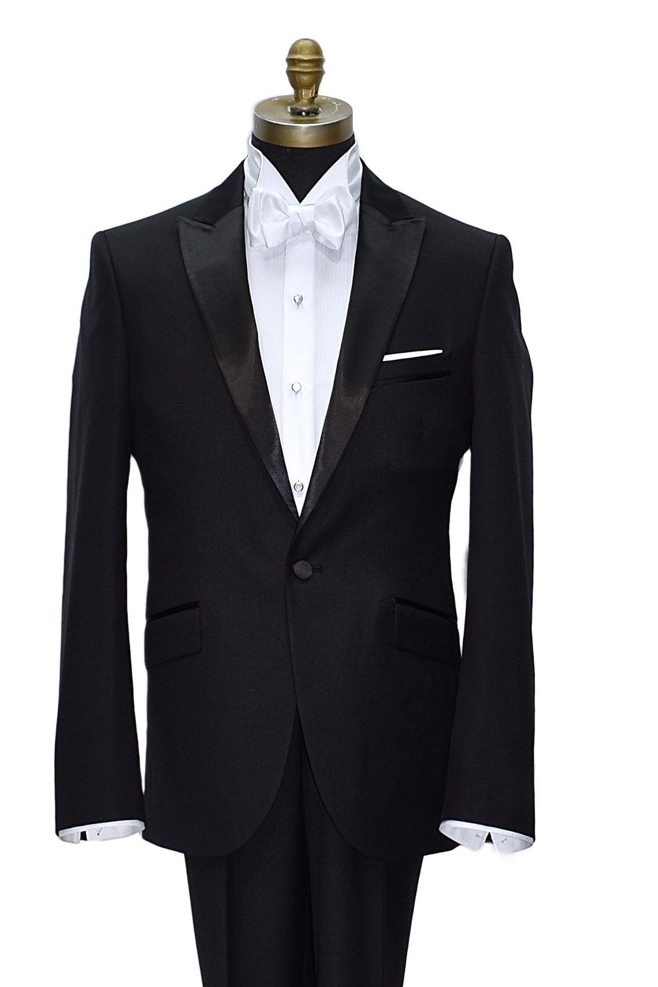 mannequin wearing black peak lapel tuxedo with mother-of-pearl studs and white wing collar tuxedo shirt and a white "tie-yourself" bowtie against a white background
