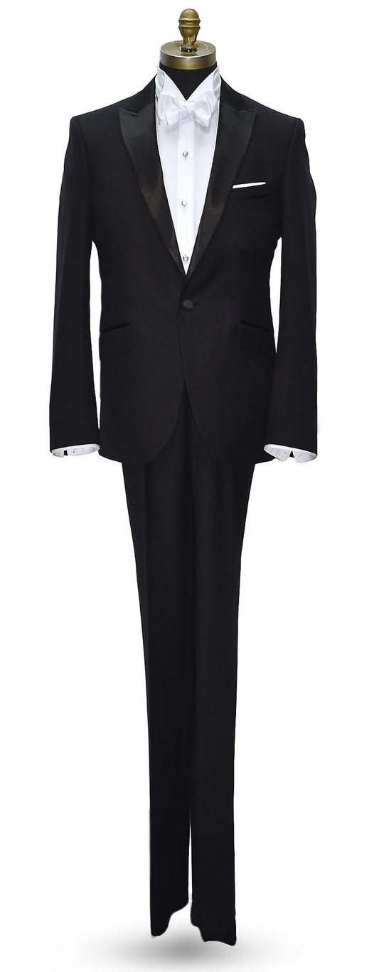 black peak lapel tuxedo with a white wing collar tuxedo shirt and a white "tie-yourself" bowtie on a mannequin against a white background