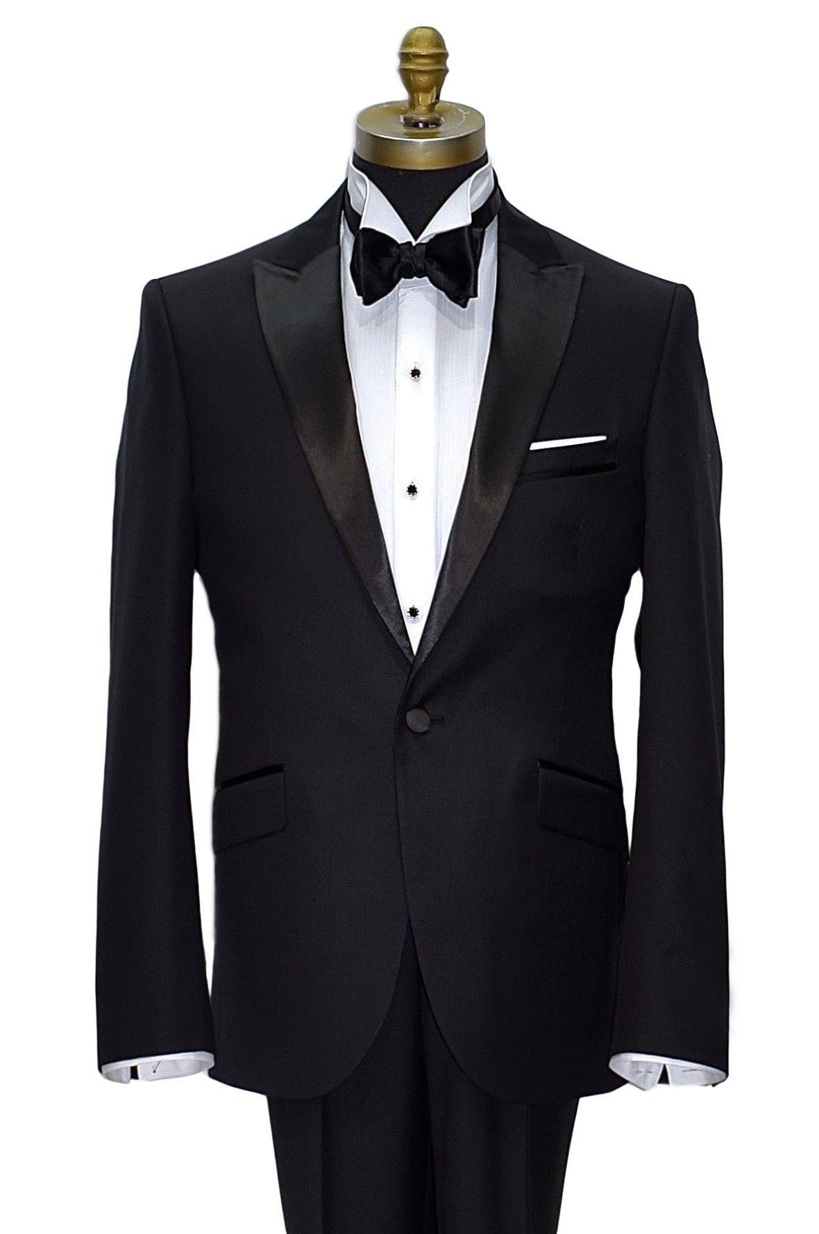 black peak lapel tuxedo wearing a white shirt and black bowtie against a white background