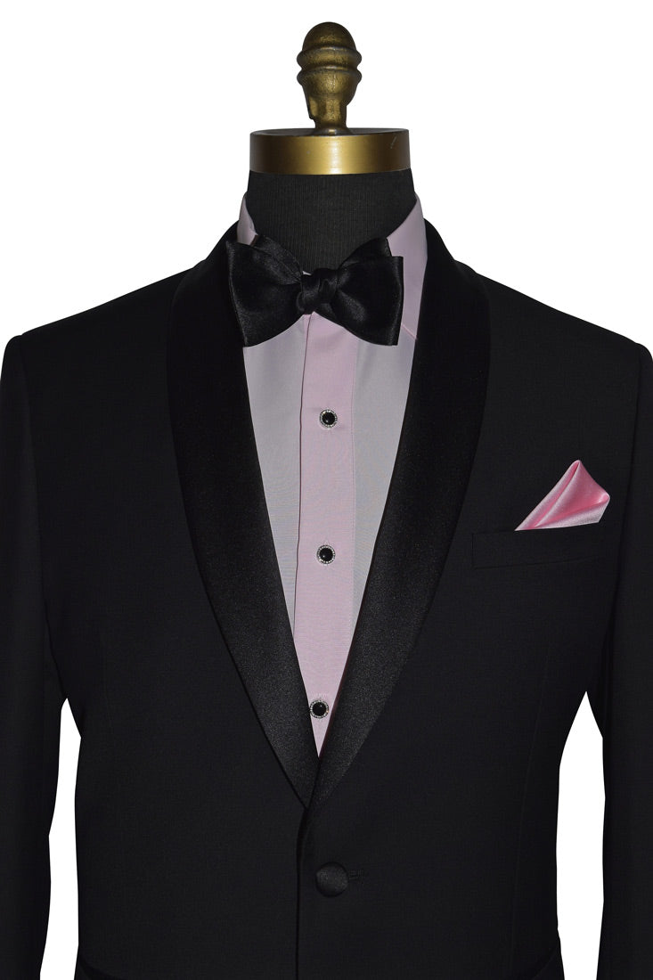 black tuxedo with a pink shirt and a black "tie-yourself" bowtie against a white hackground