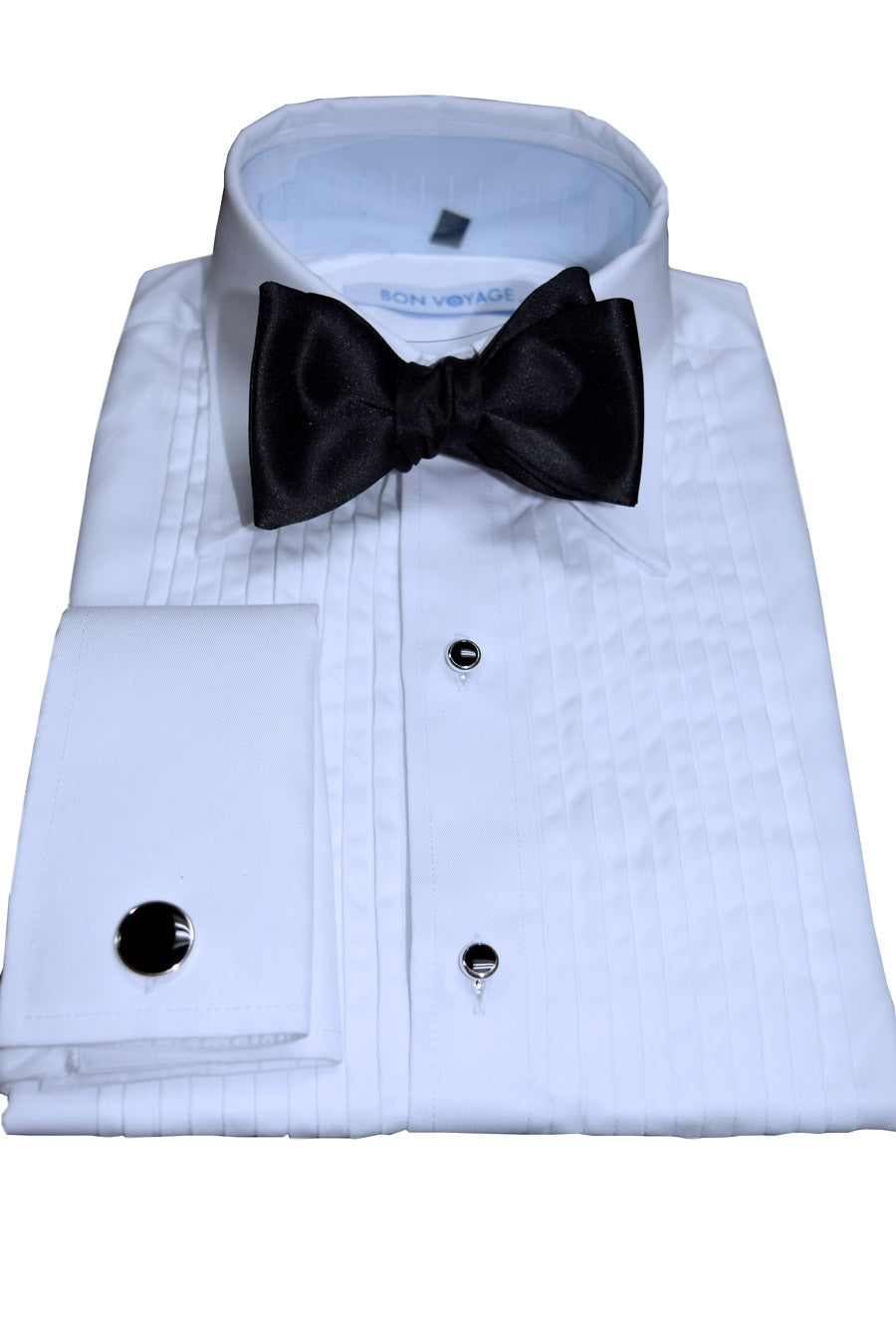 White dress shirt with black bow "tie-yourself" bowtie and cufflinks on a white background