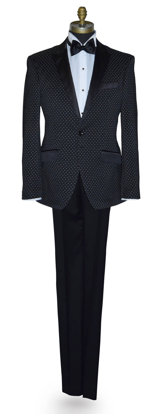 Black tuxedo with white pin-dot on a mannequin against a white background