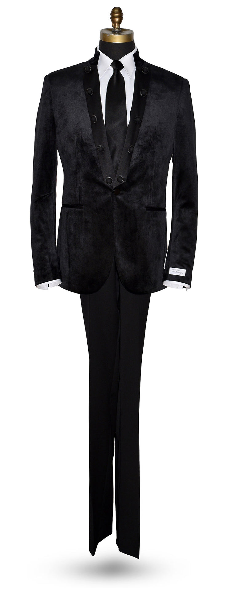 life size mannequin wearing a black velvet nehru jacket with long black necktie against a white background