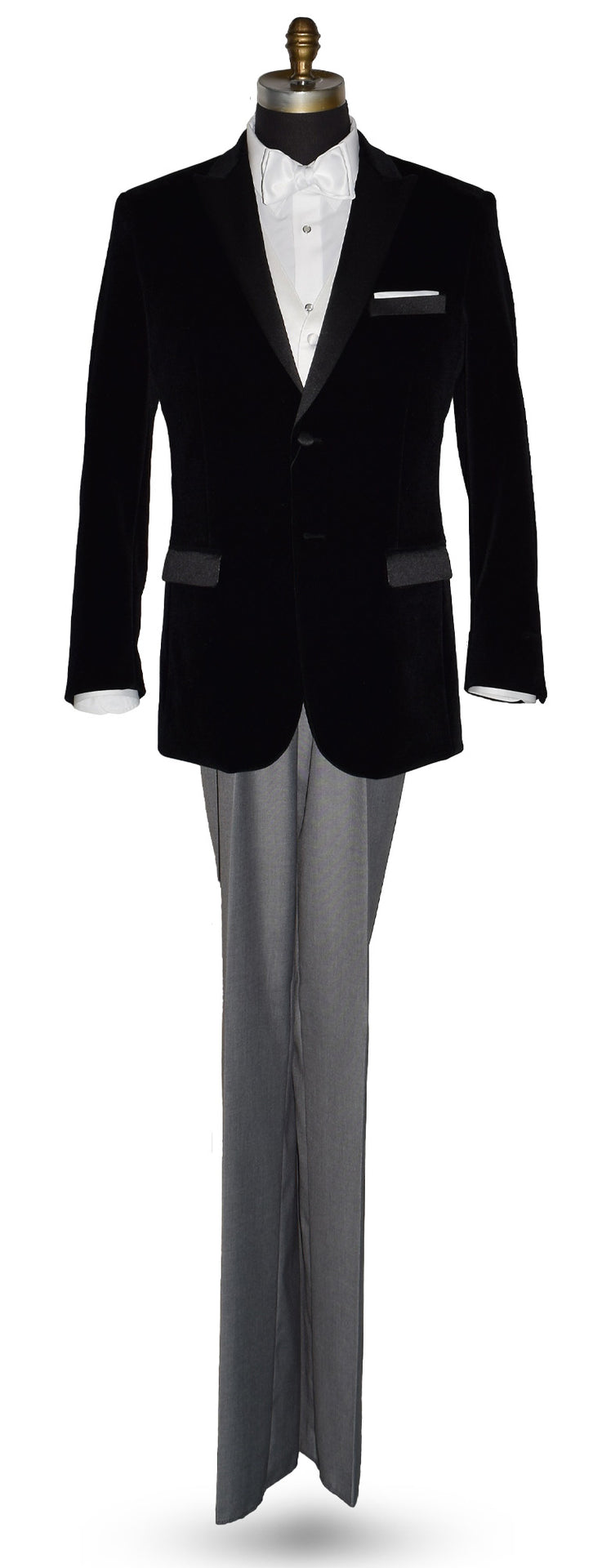 Black velvet tuxedo with white shirt and gray pants and a white satin bowtie on a mannequin against a white background