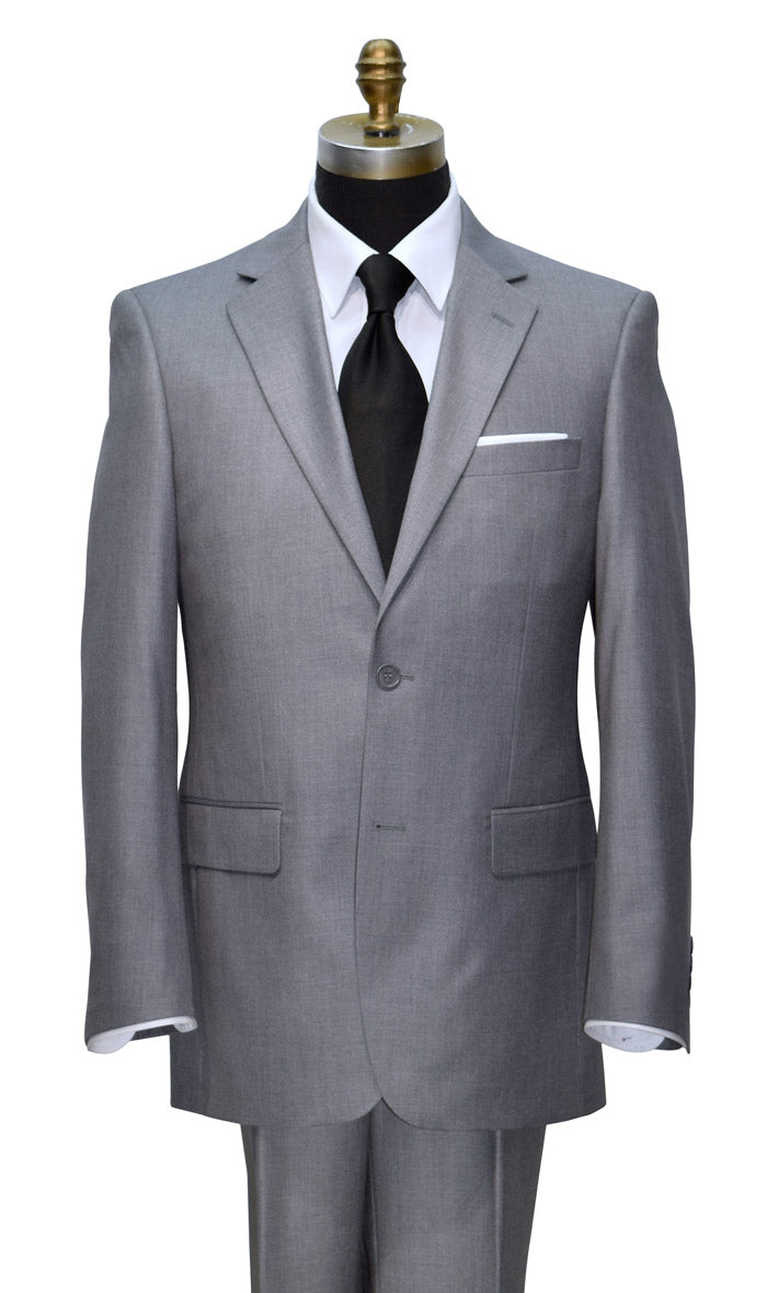 Gray suit with a black necktie on a mannequin against a white background