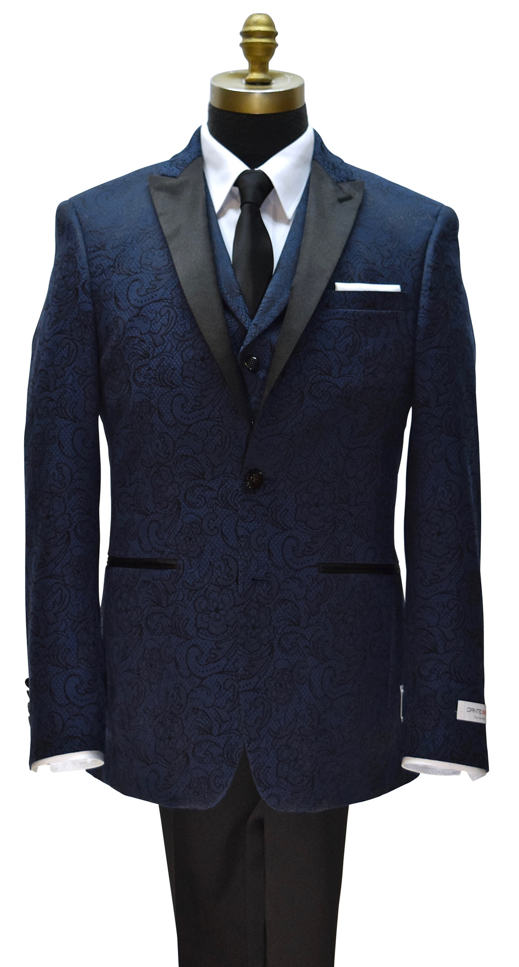 mannequin wearing a navy blue paisley tuxedo with matching navy blue paisley vest on a mannequin with a long black necktie against a white background