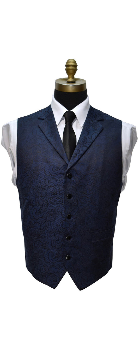 close-up Navy blue paisley vest on a mannequin with a white shirt and black tie against a white background