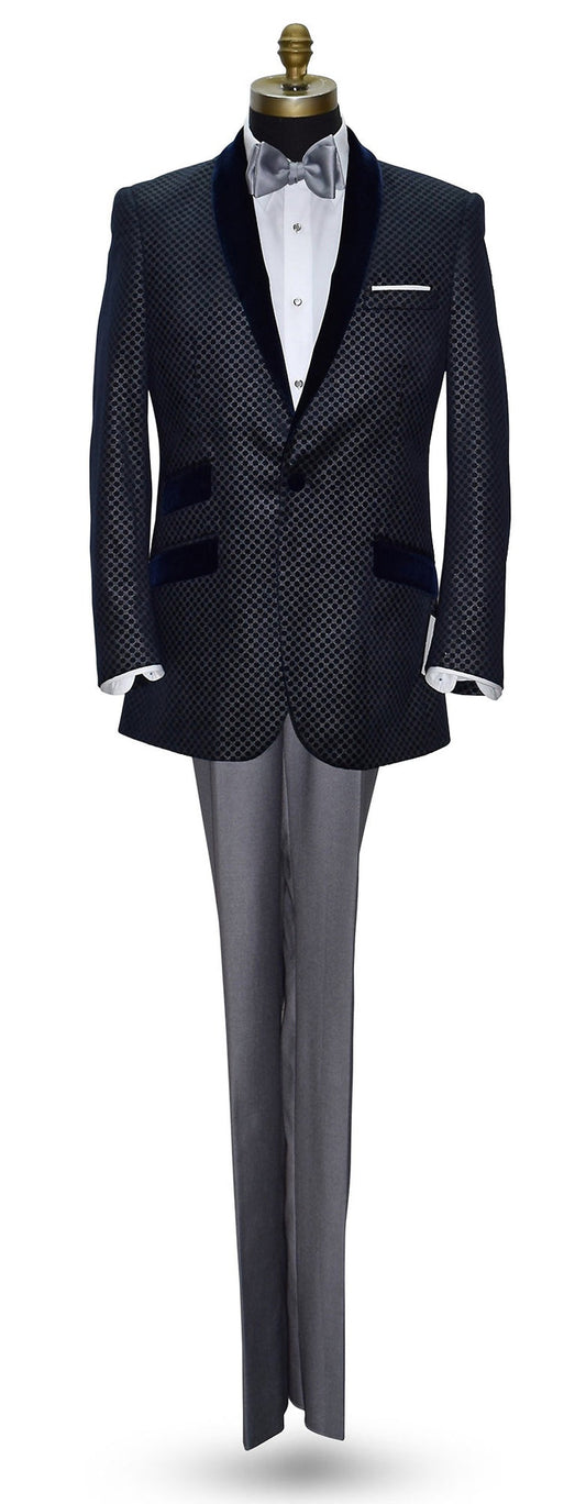 blue velvet dinner jacket with silver pattern on a mannequin with gray pants and gray bowtie
