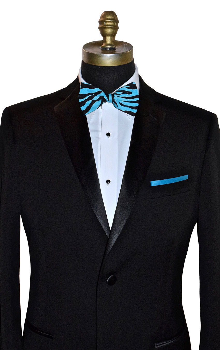 Black tuxedo with a blue and black zebra print bow tie on a mannequin against a white background.
