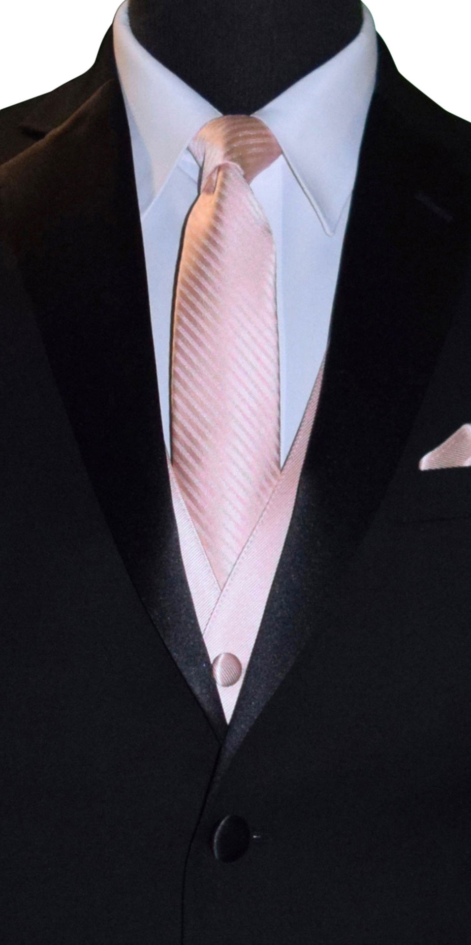 Black suit with a blush necktie and matching pocket square on a mannequin.
