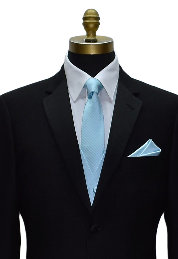 black tuxedo wearing a capri-blue tuxedo vest and capri-blue striped necktie and pocket handkerchief against a white background